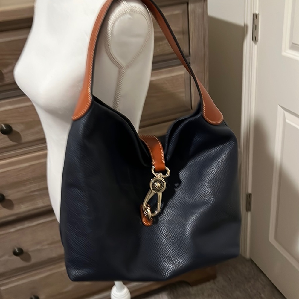 Dooney & Bourke. Great condition navy leather brown leather trim red int EUC
